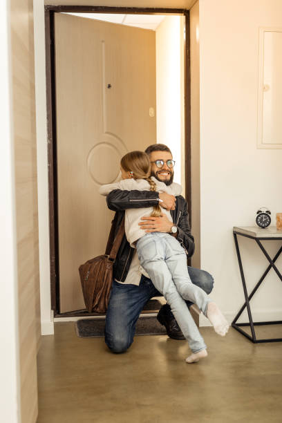 istock Attractive tall short-haired bearded man from generation Y hugging his daughter 1092779934
