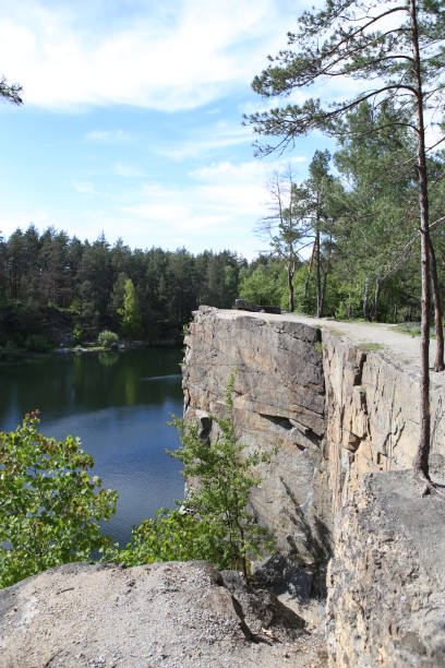 istock stone canyon trees over quarry lake 1092784442