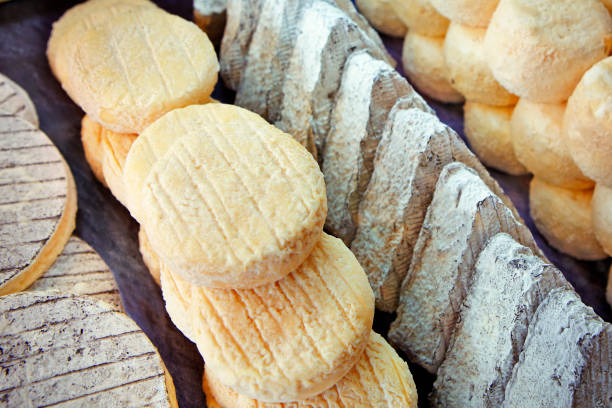 Detail of various types of traditional french cheese on the market in Paris