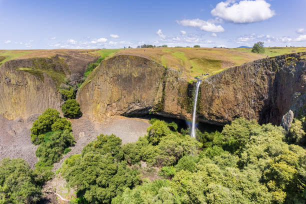 istock Phantom Waterfall dropping off over vertical basalt walls, North Table Mountain Ecological Reserve, Oroville, California 1092789952