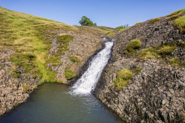 istock Small waterfall dropping into a pool, North Table Mountain Ecological Reserve, Oroville, California 1092790124