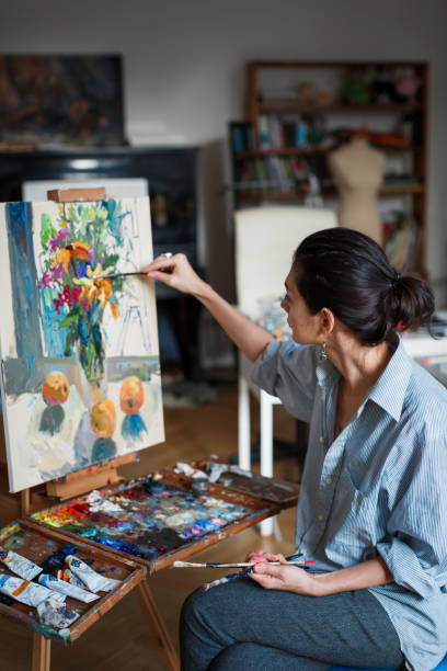 istock A young woman artist in the  studio 1092792870