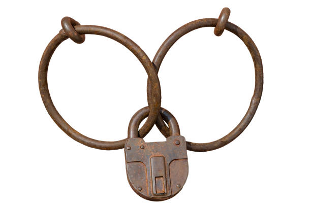 Locked rusty padlock on rings stock photo
