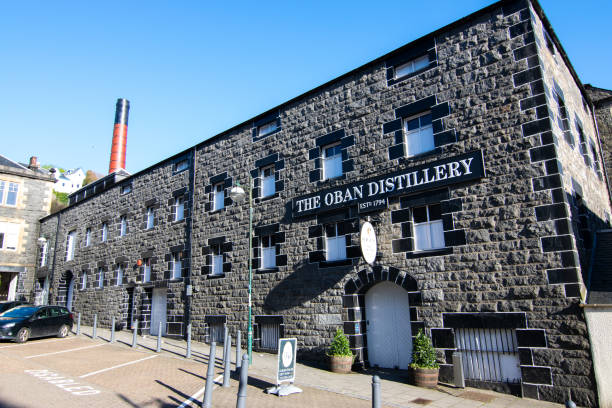 The Oban Distillery in Oban, Scotland Whisky distillery in the Scottish town Oban on the west coast of Scotland. oban stock pictures, royalty-free photos & images