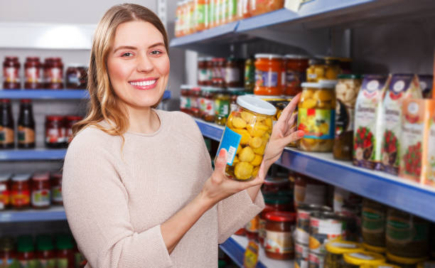 istock Woman choosing pickle goods 1092803582