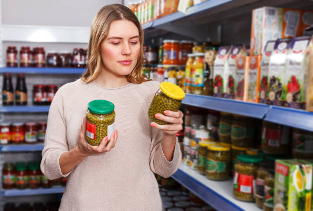 istock Woman choosing pickle goods 1092803594