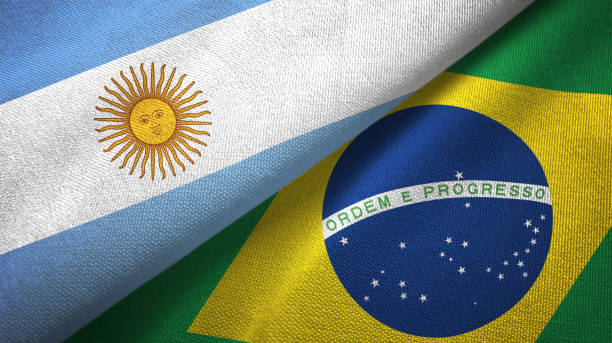 istock Brazil and Argentina two flags together realations textile cloth fabric texture 1092803726