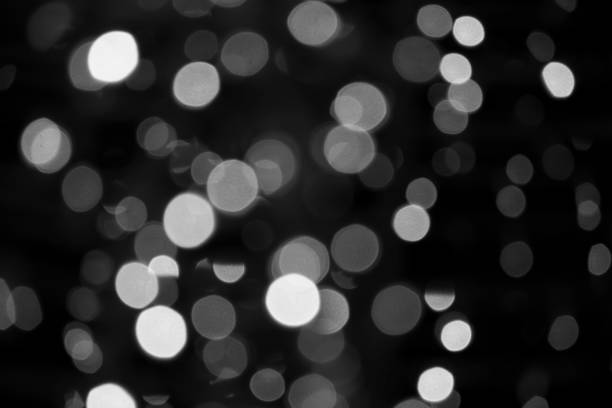 istock Bokeh white and black blurred background. Abstract light bokeh background 1092804230