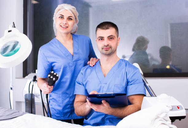 istock Two confident beauticians working in clinic 1092804510