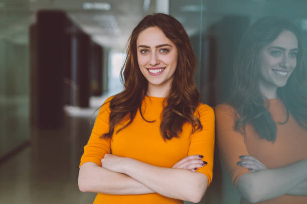 smiling businesswoman at work - estudante universitária imagens e fotografias de stock