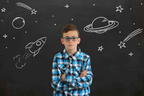 istock Young boy child think idea dreaming imagination space stars 1092806894