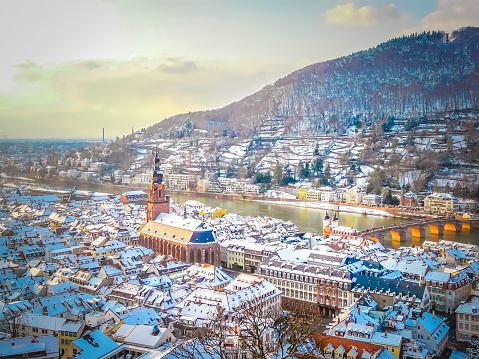 Aerial view of Heidelberg town and Neckar river in winter with snow from the castle in the Baden-Wurttemberg region of southwest Black Forest in Germany during winter Christmas time