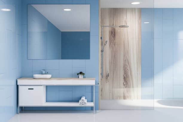 istock Sink and shower in blue bathroom interior 1092818018