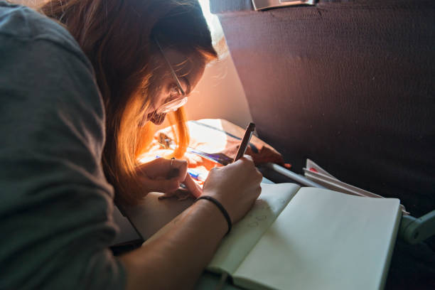 istock Millennial woman travelling alone in plane. 1092832630