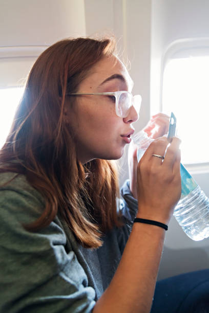 istock Millennial woman travelling alone in plane. 1092832864