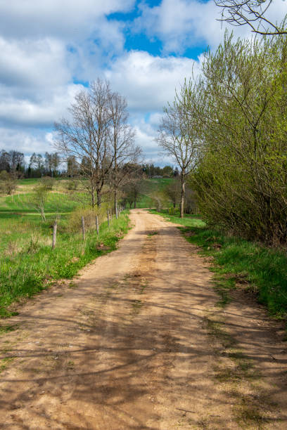 istock country gravel road with old and broken asphalt 1092836366
