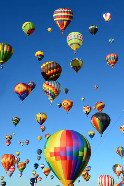 The Thrill of Hot Air Balloons Hot Air Balloons flying high over Albuquerque, New Mexico bernalillo county stock pictures, royalty-free photos & images