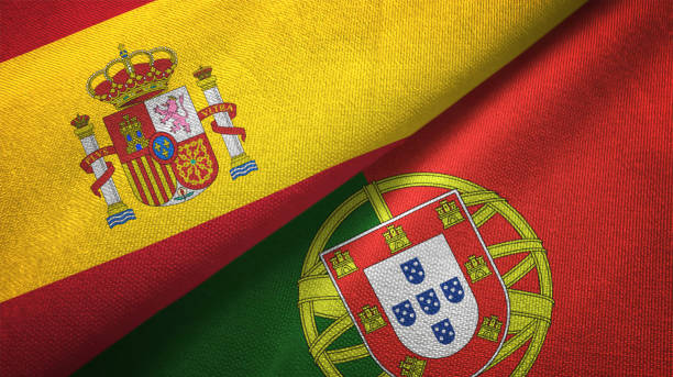 portugal y españa dos banderas juntos relaciones textil tela textura de la tela - spain flag spanish flag national flag fotografías e imágenes de stock