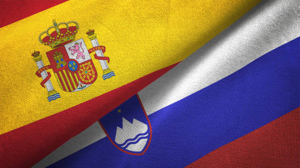 istock Slovenia and Spain two flags together realations textile cloth fabric texture 1092845474