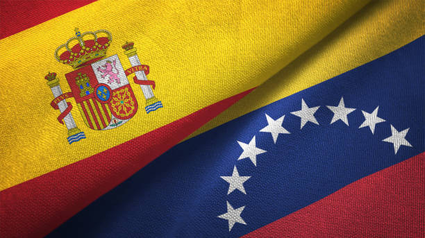 venezuela and spain two flags together realations textile cloth fabric texture - venezuelan flag imagens e fotografias de stock