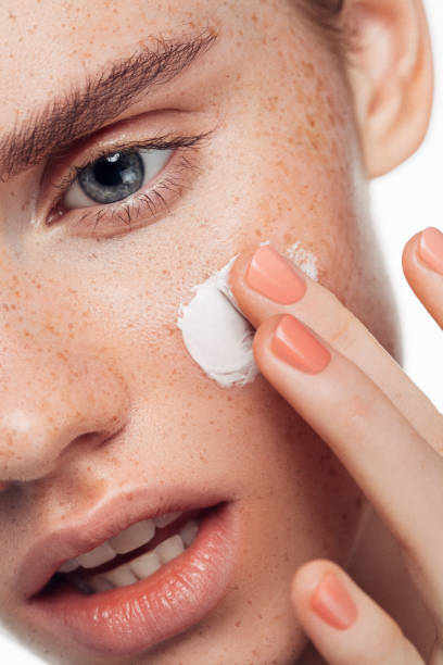 istock Girl applying cream 1092846944