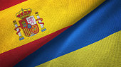Ukraine and Spain two flags together realations textile cloth fabric texture