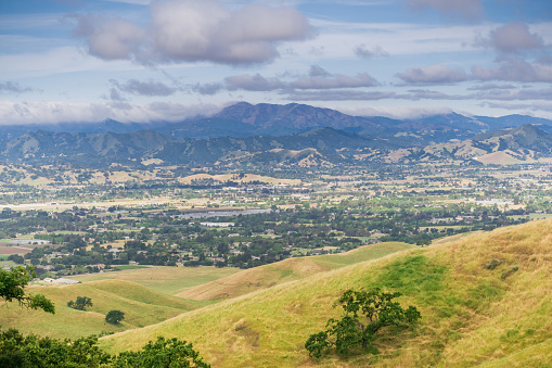 Aerial view of South Valley town as seen from Coyote Lake Harvey Bear Ranch County Park, Loma Prieta in the background, south San Francisco bay, California