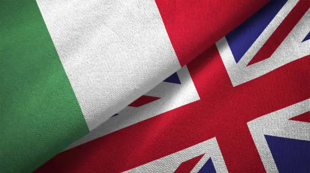 Photo of United Kingdom and Italy two flags together textile cloth fabric texture