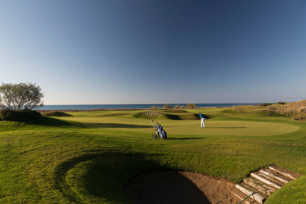 istock Links golf area wide angle photo while golf player shooting 1092863788