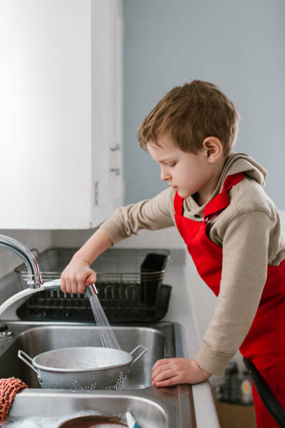 istock Child cooking and baking in kitchen at home 1092866266