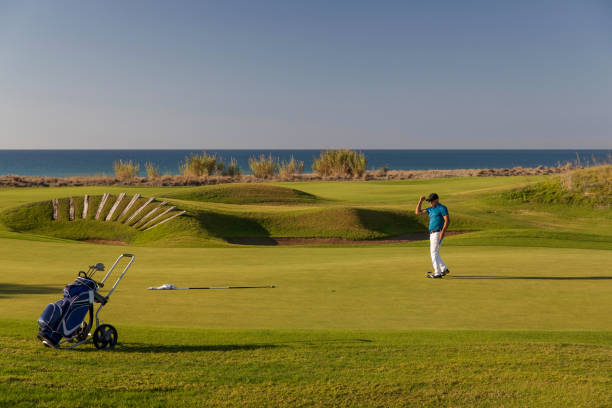 istock Links golf area wide angle photo while golf player shooting 1092866656