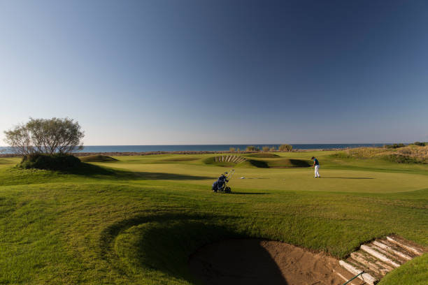 istock Links golf area wide angle photo while golf player shooting 1092866666
