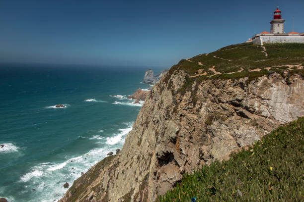 istock View at Cabo da Roca Lighthouse (Portuguese: Farol de Cabo da Roca) which is Portugal's most westerly point. 1092867066