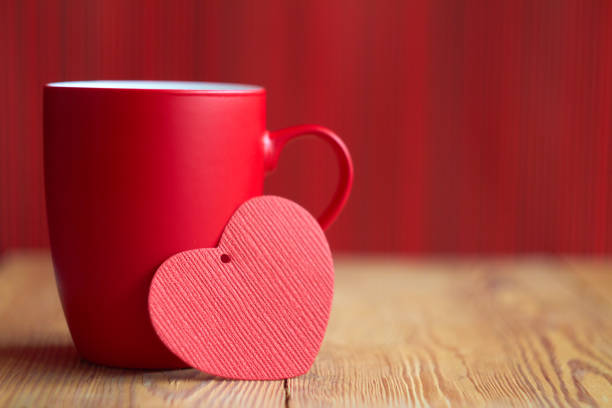 istock Valentine with red cup on wooden background. Close-up. 1092869698