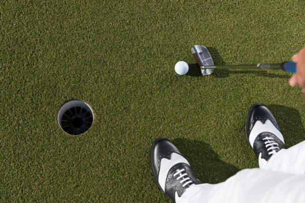 istock Golf, Golf player putting the golf ball near hole - links golf - Close up 1092870128