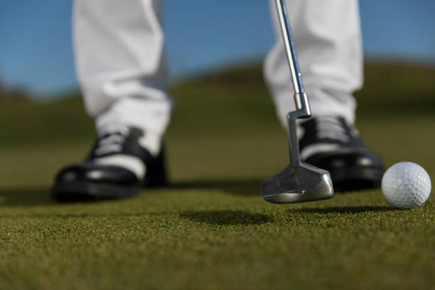 istock Golf, Golf player putting the golf ball near hole - links golf - Close up 1092870792