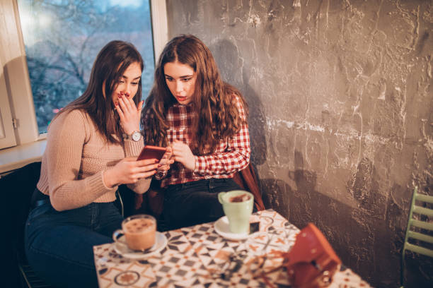 istock Two female friends on a coffee break downtown 1092872374