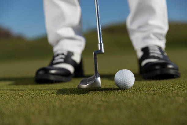 istock Golf, Golf player putting the golf ball near hole - links golf - Close up 1092872414