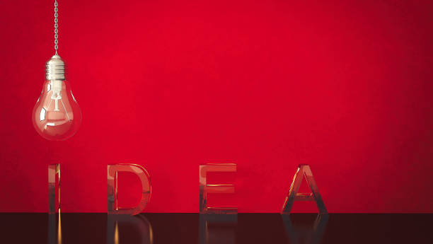 Text 'Idea' with light bulb on a red background with copy space Text 'Idea' with light bulb on a red background with copy space mm21 stock pictures, royalty-free photos & images