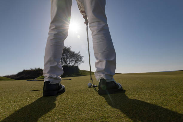 istock Golf, Golf player putting the golf ball near hole - links golf - Close up 1092873546