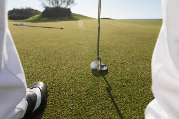istock Golf, Golf player putting the golf ball near hole - links golf - Close up 1092873904
