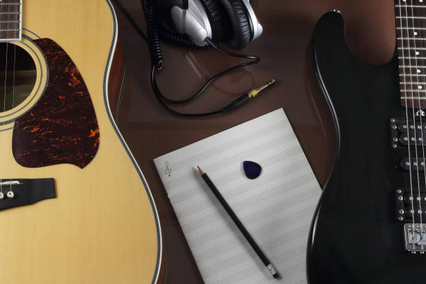 istock Guitars, studio earphones and musical leaf 1092877864