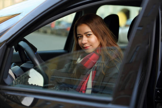 istock Cute girl driving a car 1092882684
