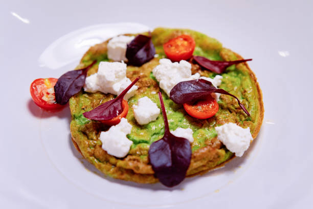 istock Omelet with vegetables cheese and tomatoes on white plate 1092896482
