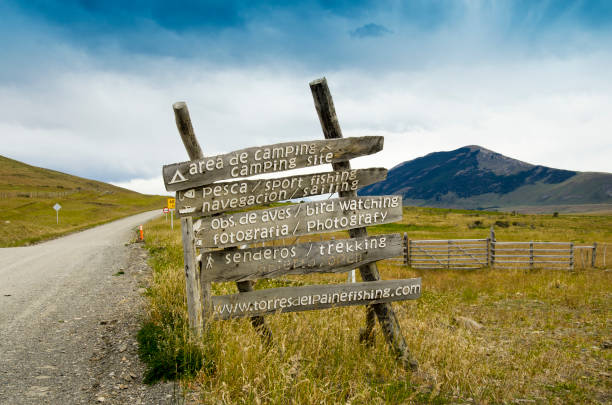 Patagonia landscape is as amazing as any nature lover would expect. Here a rustic information sign gives information on the distance within the park.