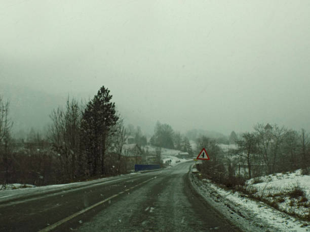 istock On the mountain road during the snow blizzard 1092903938