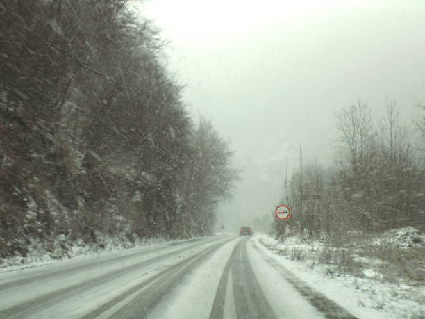 istock On the mountain road during the snow blizzard 1092906178