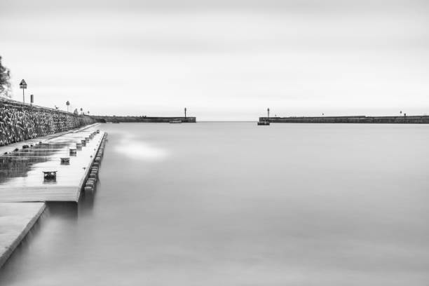 istock Long exposure harbour photography - black and white 1092906190
