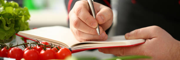 istock An open book of recipes on background 1092906728