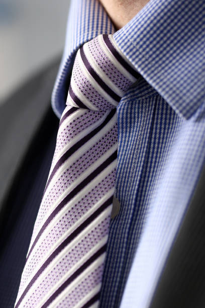istock Business man in black suit set tie closeup 1092907092